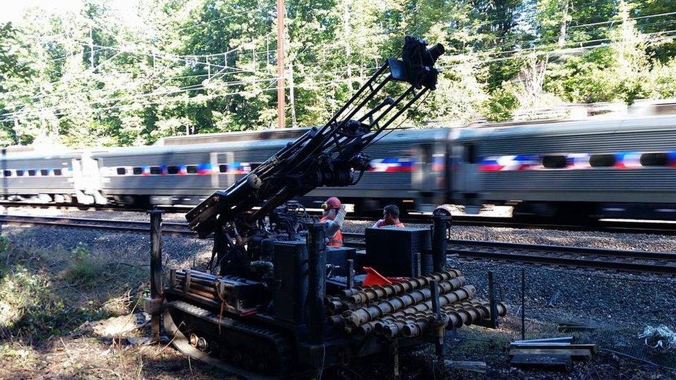Train goes past search site