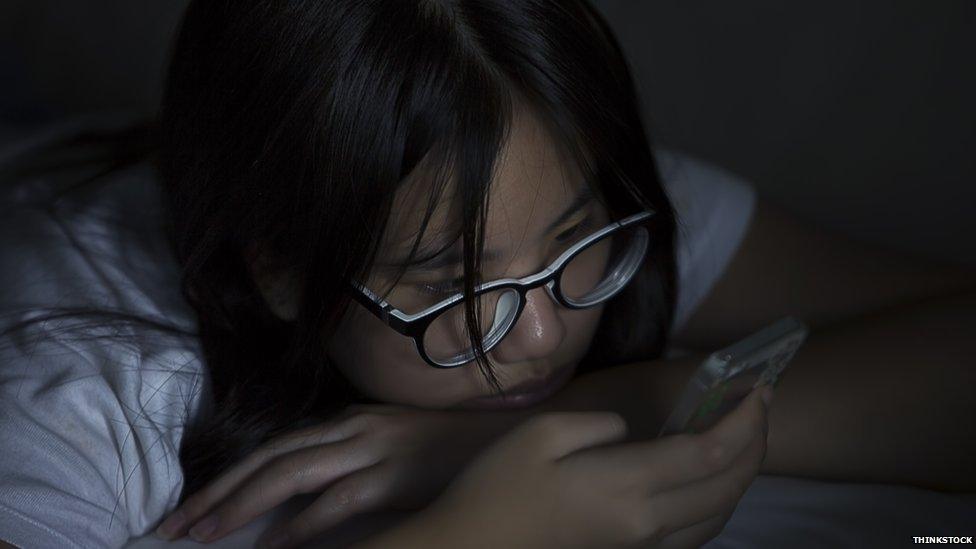 Teenager texting at night