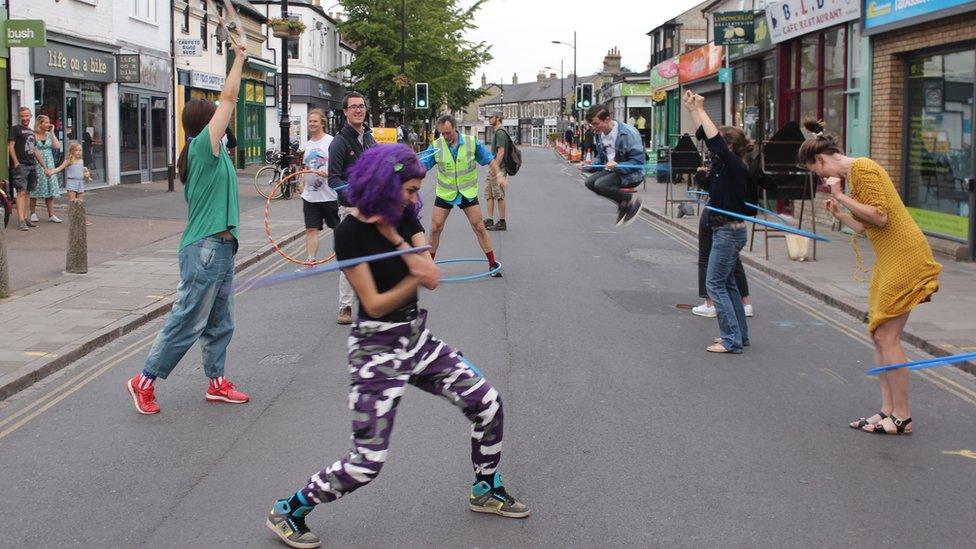 Hula hoopers on Mill Road, Cambridge