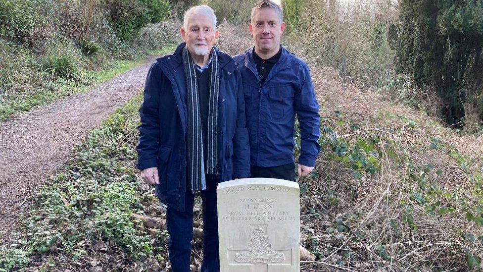 Reg and Andrew in front of Harry Dunn's grave