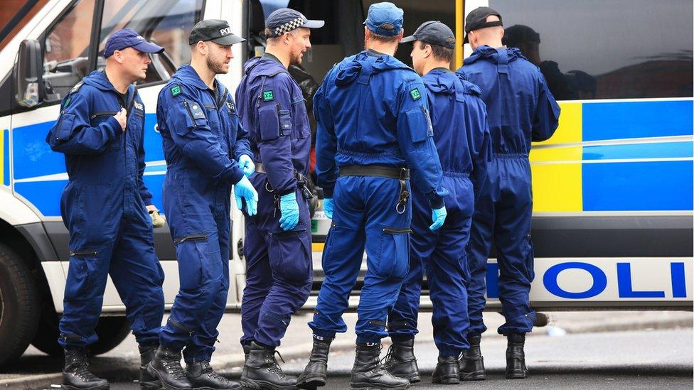 Firearms officers at the scene of the shooting