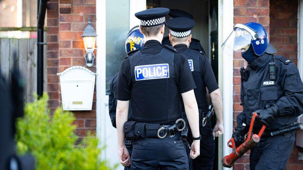 Police raid a house