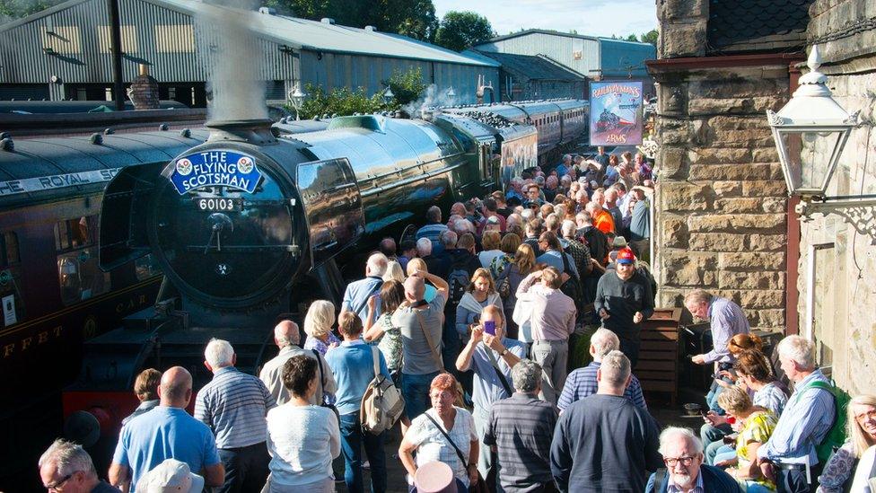 Crowds greeting the engine