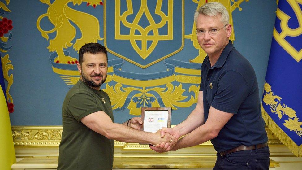 Ukraine President Volodymyr Zelensky and BAE Systems Chief Executive Charles Woodburn