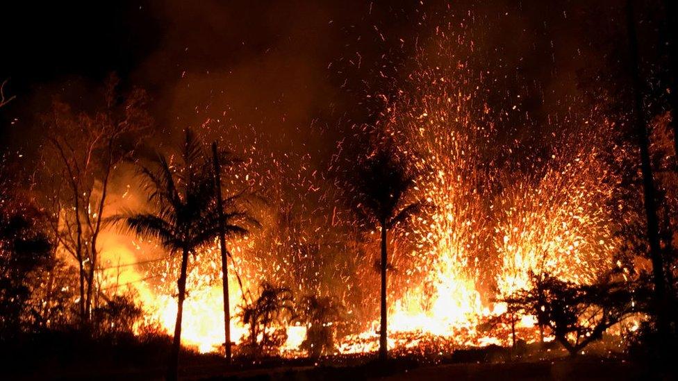 In this handout photo provided by the U.S. Geological Survey, lava erupts from a new fissure from Luana Street after the eruption of Hawaii's Kilauea volcano on May 5, 2018 in the Leilani Estates subdivision near Pahoa, Hawaii.