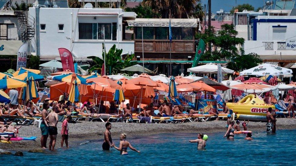 Tourists on a beach in Kos, Greece