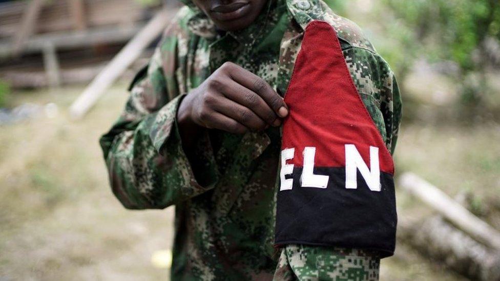 A rebel of Colombia"s Marxist National Liberation Army (ELN) shows his armband while posing for a photograph, in the northwestern jungles, Colombia on 31 August 2017.