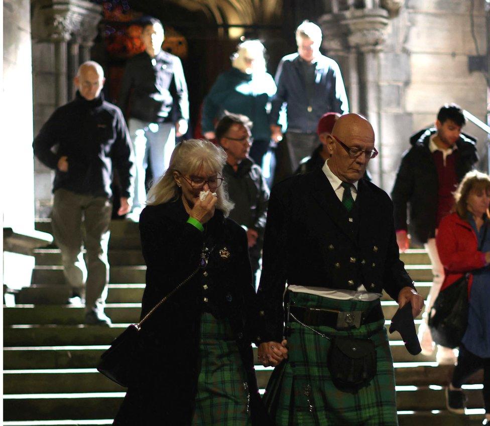 mourners leaving St Giles