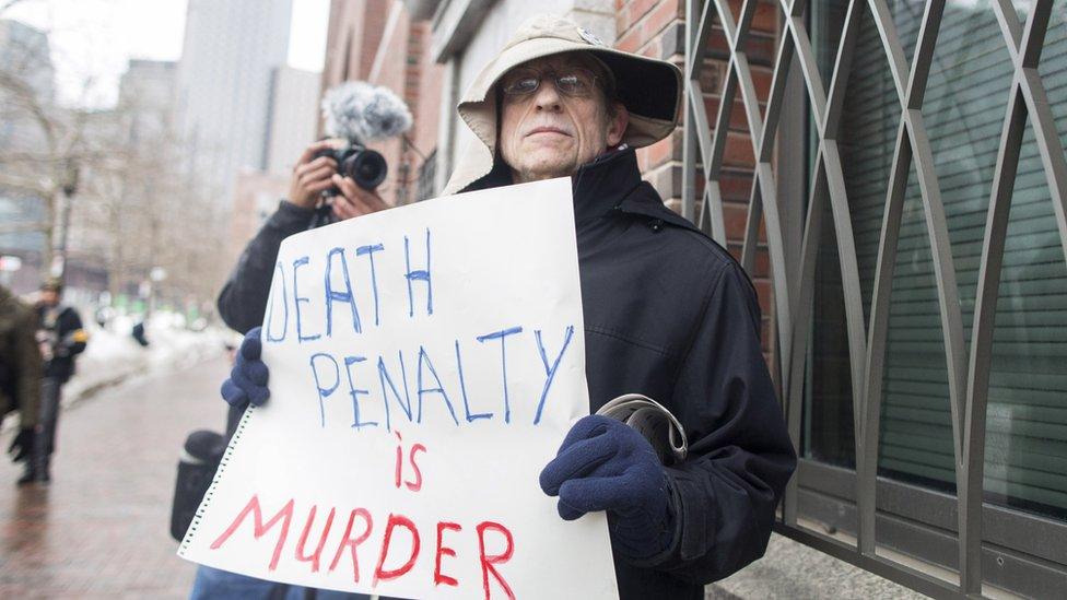 A demonstrator at the trial of Boston bomber Dzhokhar Tsarnaev, who was sentenced to death