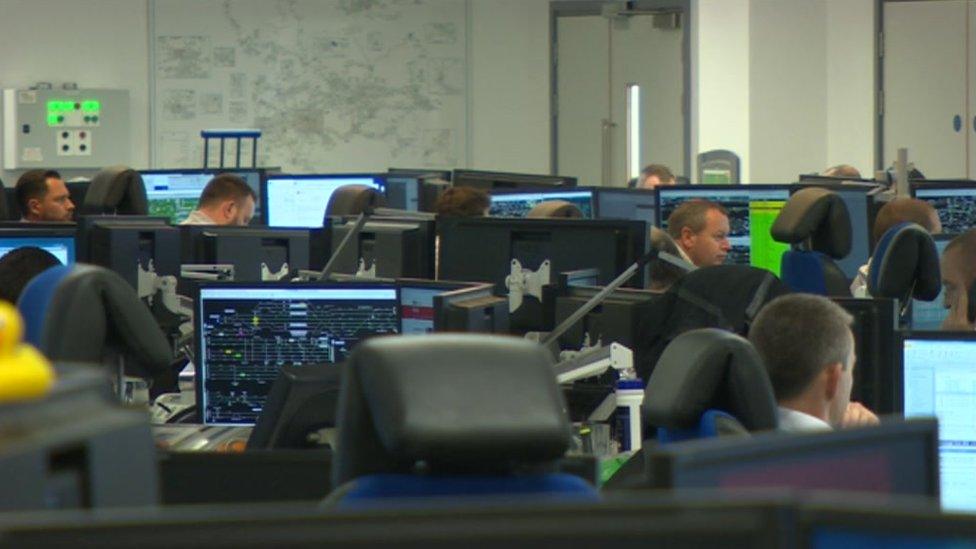 People working in a computerised office