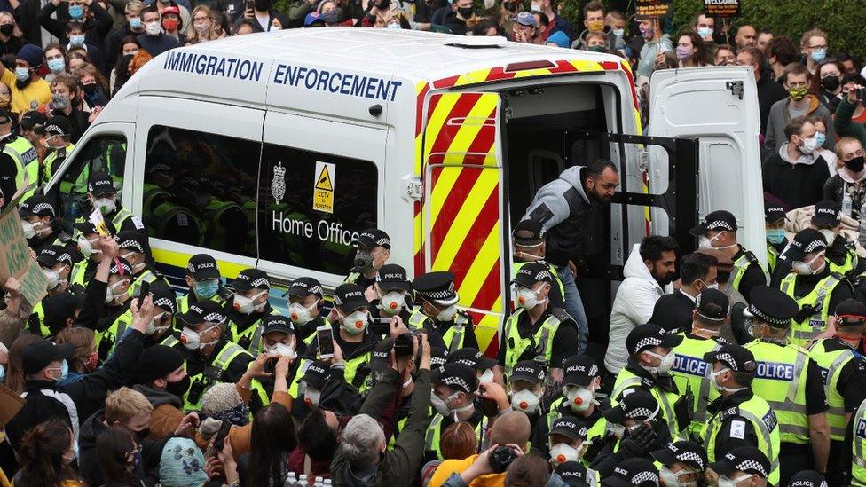 Two men are released from the back of an Immigration Enforcement van accompanied by lawyer Aamer Anwar and Mohammad Asif, director of the Afghan Human Rights Foundation, in Kenmure Street, Glasgow