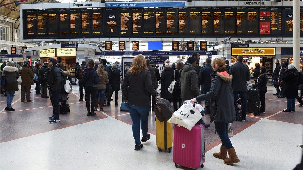 Passengers at London Victoria railway station