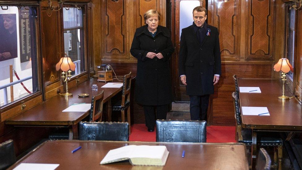 German Chancellor Angela Merkel and French President Emmanuel Macron inside the train carriage in which the ceasefire agreement between the German Reich and France was signed on 11 November 1918