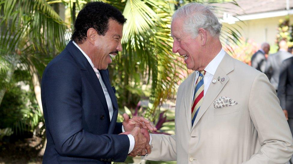 Lionel Richie shaking hands with King Charles in Barbados