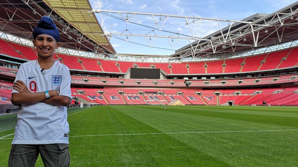 Balraj standing pitch side at Wembley