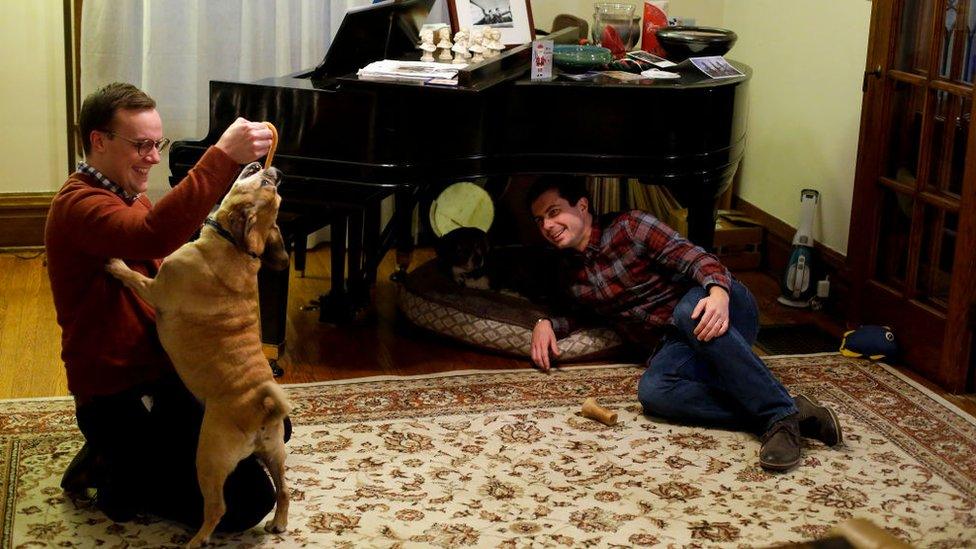 Mr Buttigieg with his husband Chasten Glezman and their dog Buddy at their Indiana home