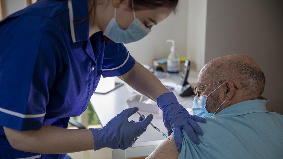 Nurse giving vaccine injection