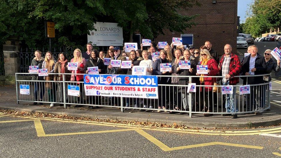 People gathered outside St Leonard's Catholic School in Durham in an Raac protest