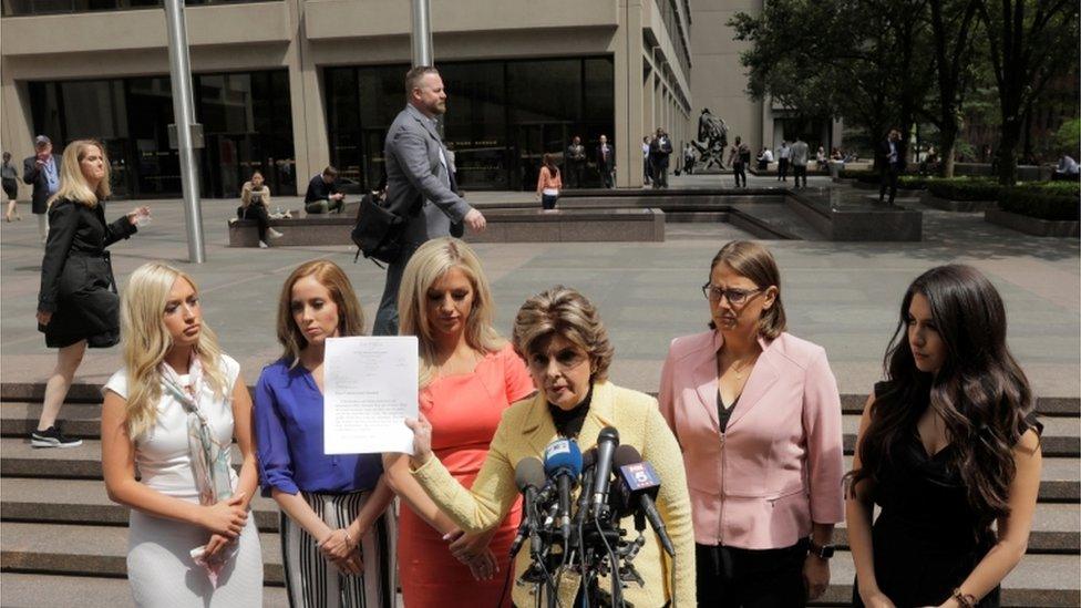 Former cheerleaders and lawyer outside of NFL headquarters in NYC