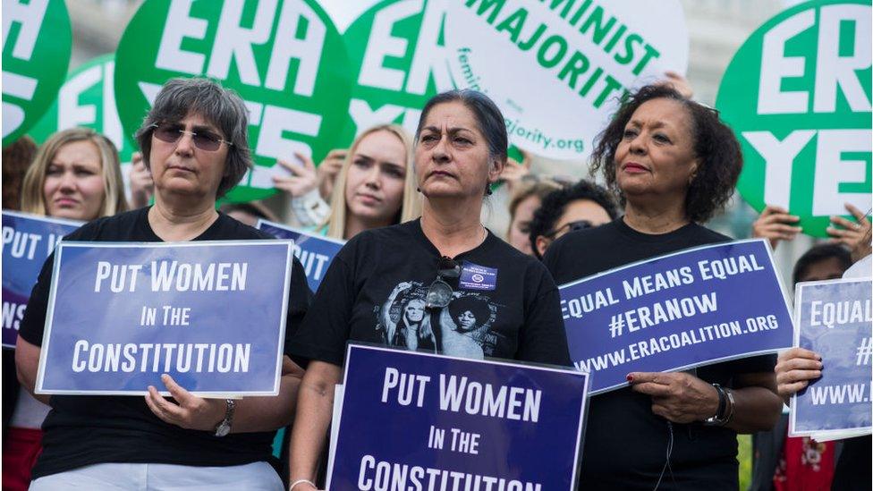 Jessica Lenahan, center, a domestic violence survivor, and Carol Jenkins, right, of the Equal Rights Amendment Task Force, attend a news conference at the House Triangle on the need to ratify the Equal Rights Amendment on June 6, 2018.