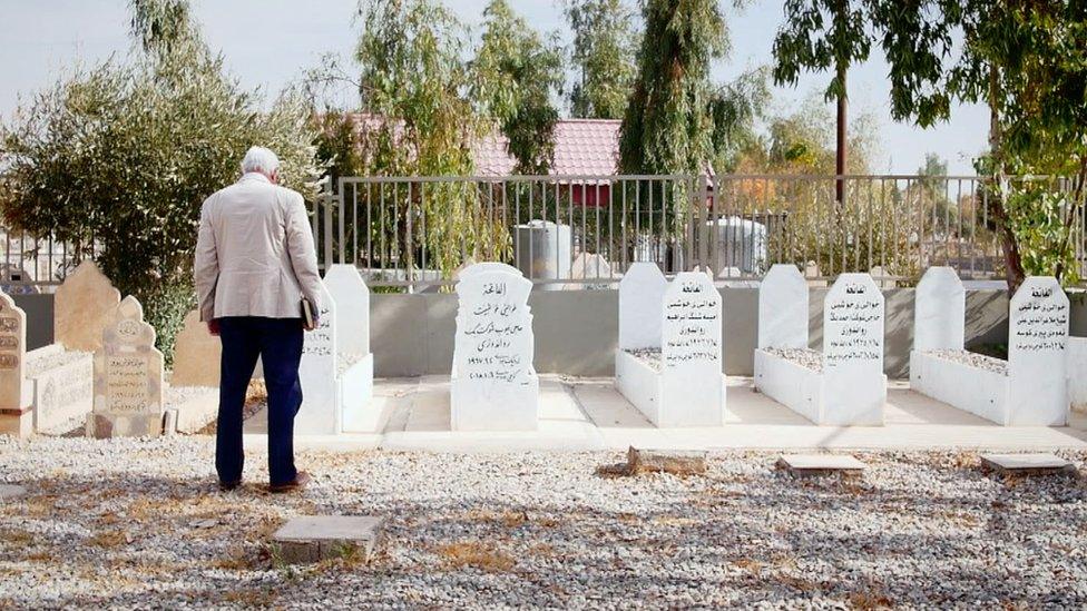 Simpson at graves of Iraqi dead