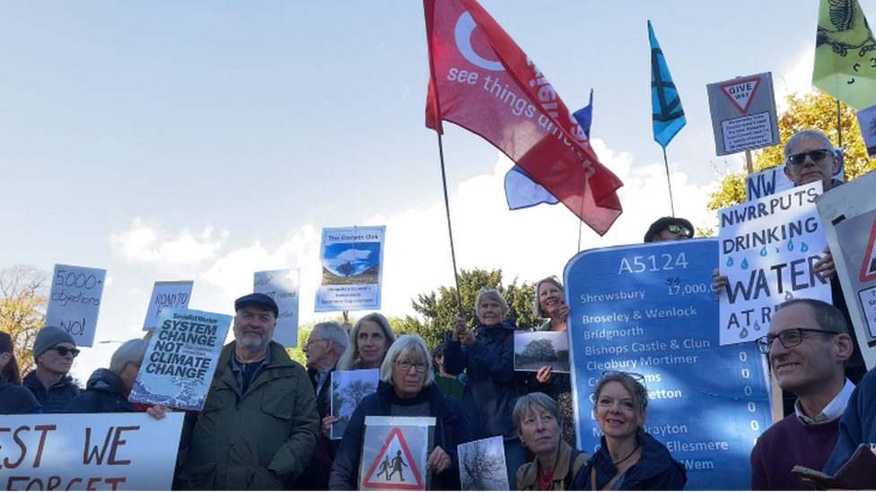 Protesters outside the meeting