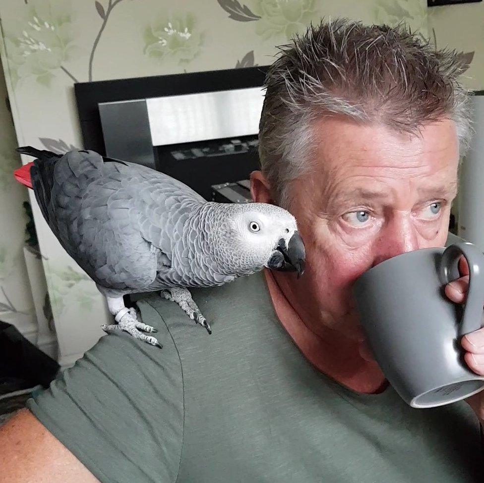 Robert Towers with Rocco the parrot