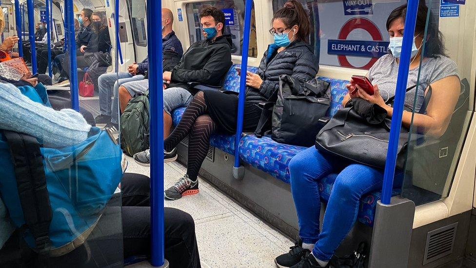 Commuters on a Tube at 08:01 in central London.