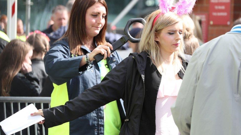 Security staff check people arriving for the One Love Manchester benefit concert