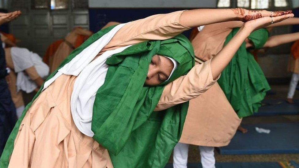 A young girl practising yoga