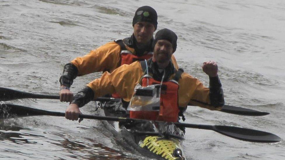 Tom Sharpe and Keith Moule in their canoe at the finish line