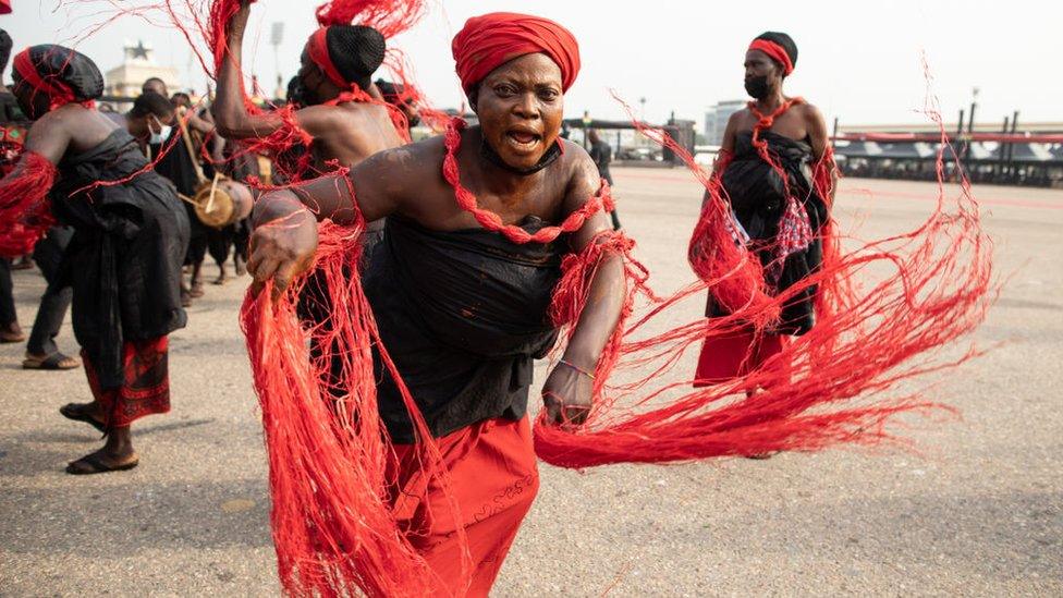 A traditional group performs the final funeral rites of former Ghana President Jerry John Rawlings in Accra, Ghana, on January 27, 2021. - Former Ghana President Jerry John Rawlings died in November 2020 at the age of 73 and his funeral was initially scheduled for December 23, 2020 but was postponed, due to what the foreign ministry called "unforeseen circumstances".