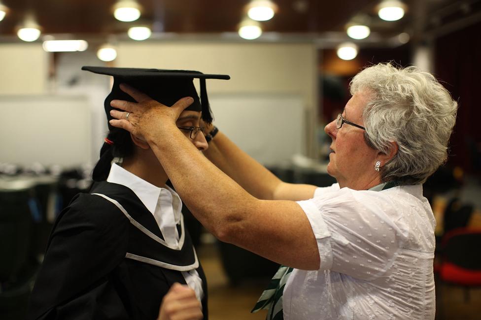 A student preparing for graduation at University of Birmingham