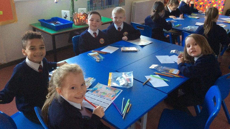 Pupils writing Santa letters