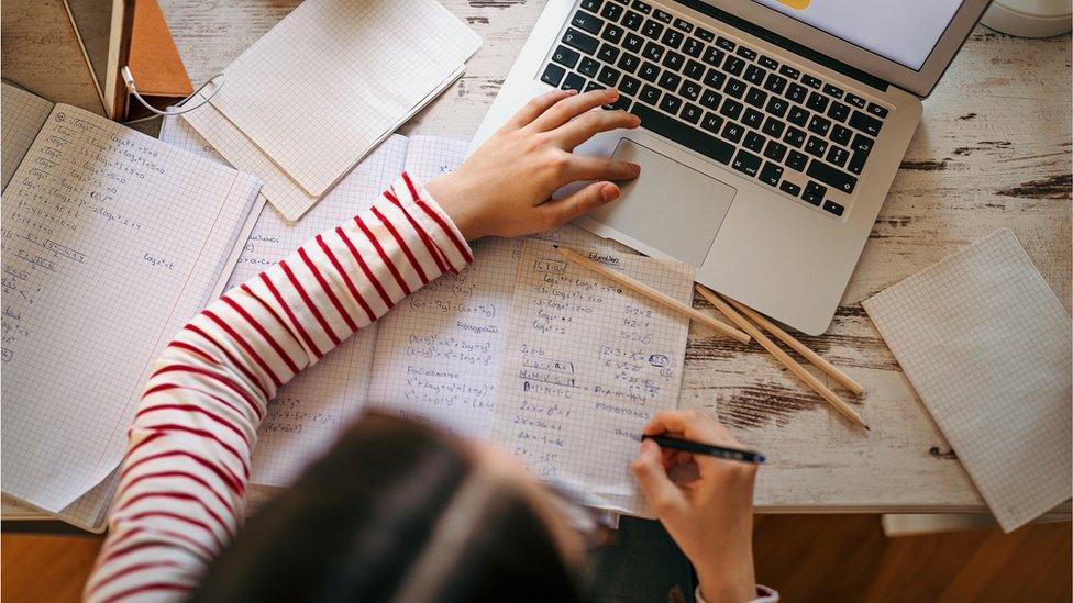 A child doing school work at home