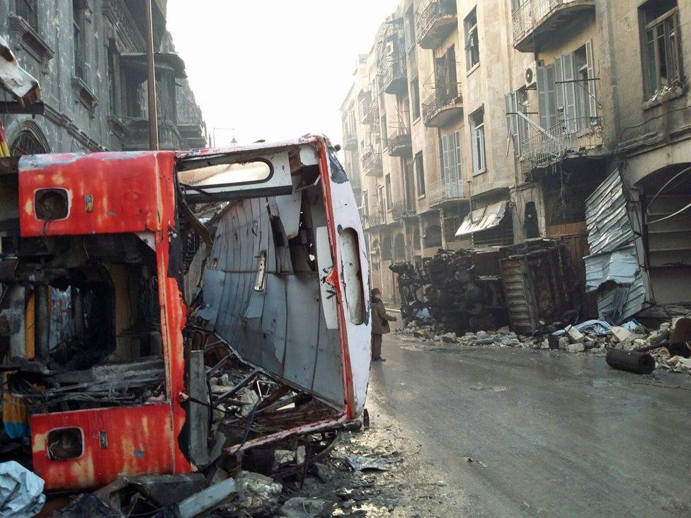 an overturned bus in Judaydah