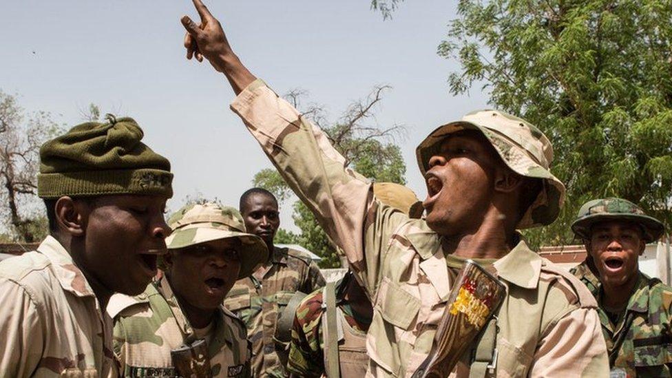 Nigerian soldiers celebrating taking over Bama from Boko Haram in 2015