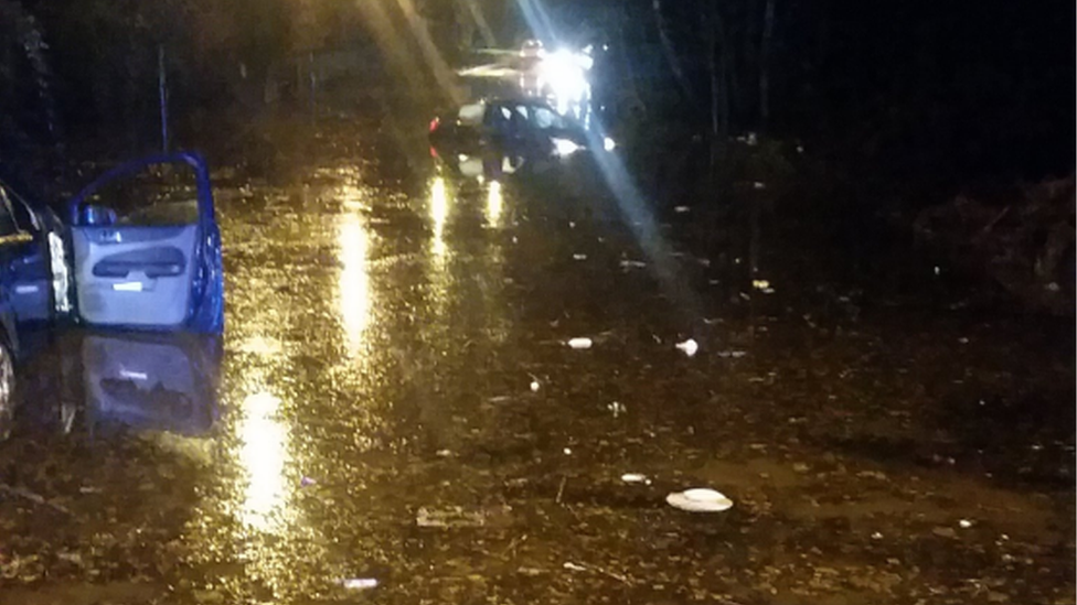 A car stuck in flood water on Brickyard Road, Aldridge