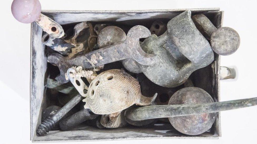 Metal items retrieved from a cremator