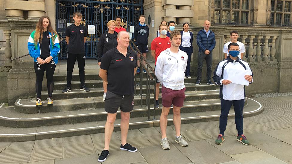 Swimmers protesting outside town hall