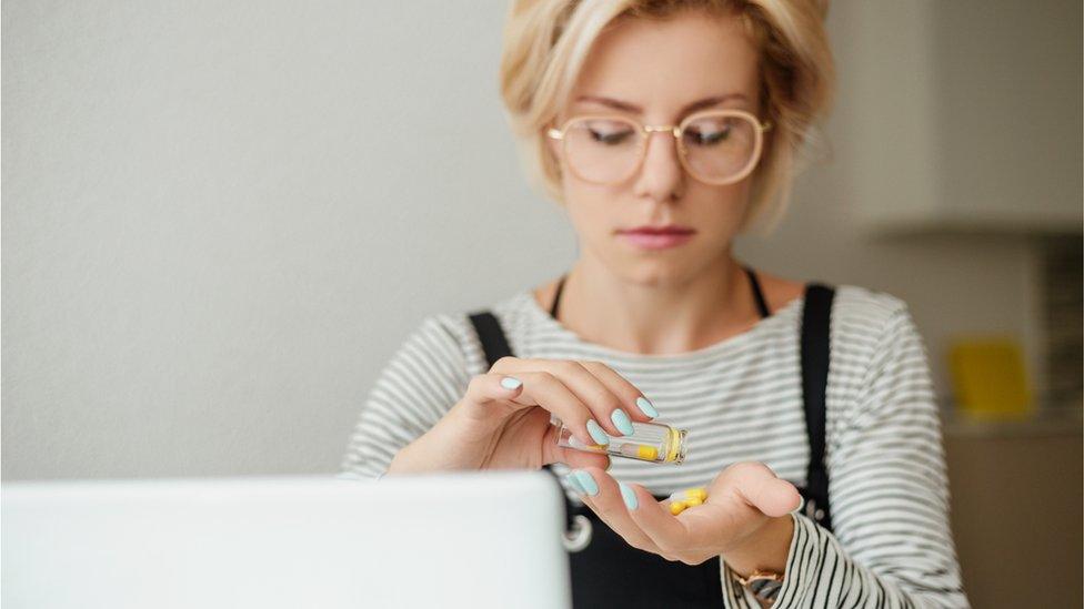 Stock photo of woman taking drugs