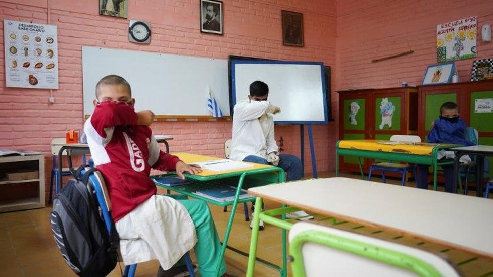 Teacher Sergio Ferraro gives instructions on safe sneezing practices at Escuela 30, a rural school that has resumed classes after a month off due to the coronavirus disease (COVID-19), in San Jose, Uruguay April 22, 2020