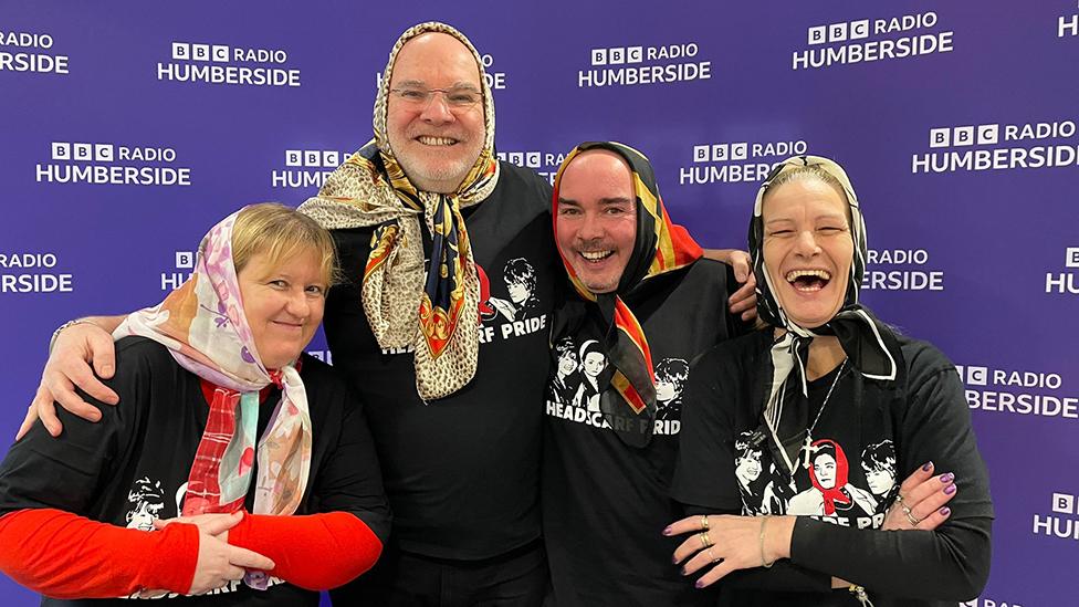 David Burns and Tracey Henry wearing headscarves