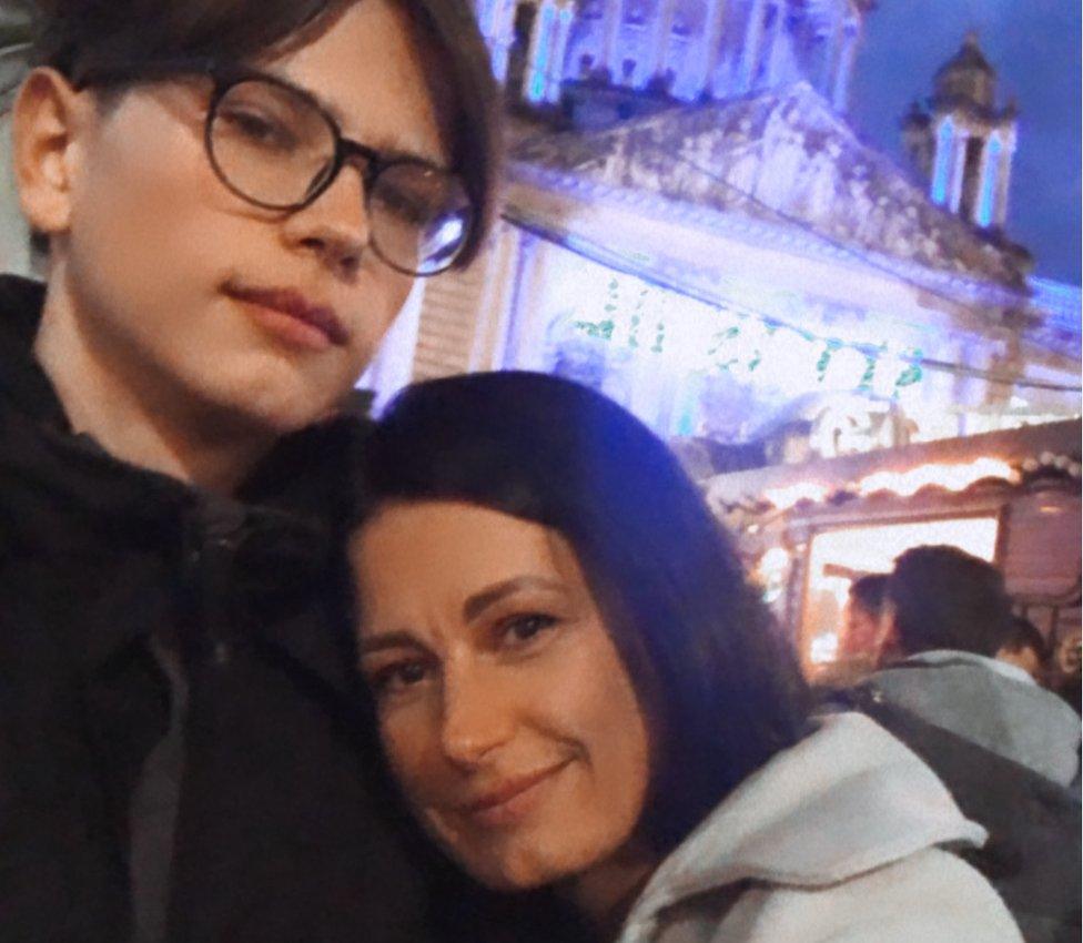 Mariana and her son pictured outside Belfast City Hall