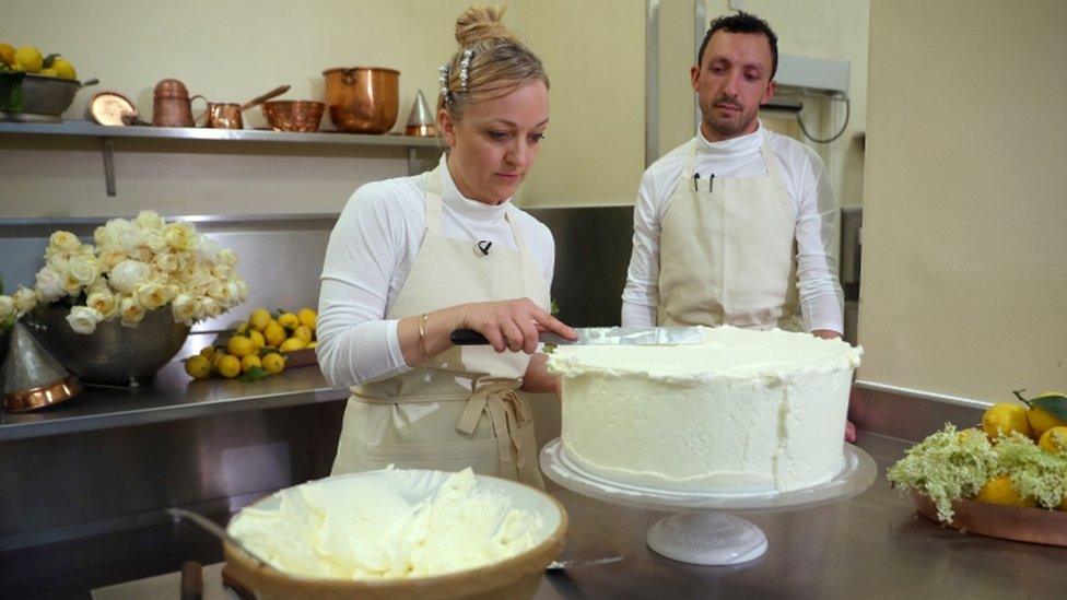 Claire Ptak and Izaak Adams icing the royal wedding cake