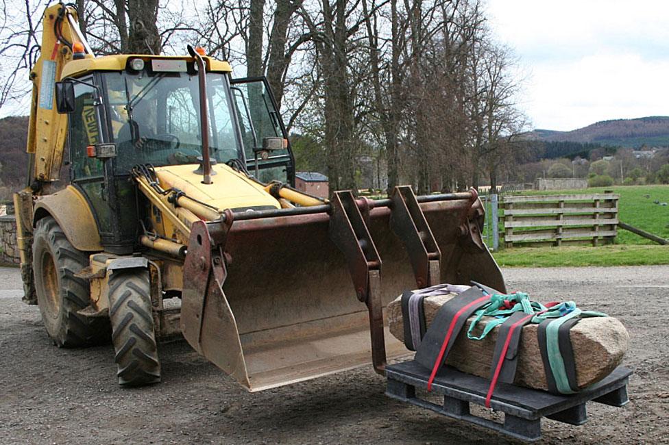 Digger with Dandaleith stone in bucket