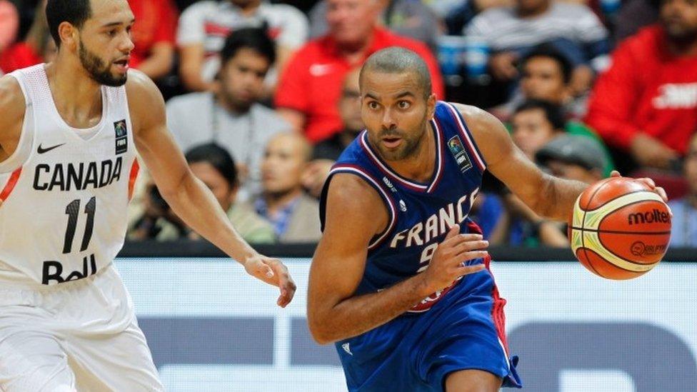 Tony Parker (right) of France in action against Tyler Ennis (left) of Canada during the 2016 FIBA Olympic Qualifying tournament final match between Canada and France in the Philippines (10 July 2016)