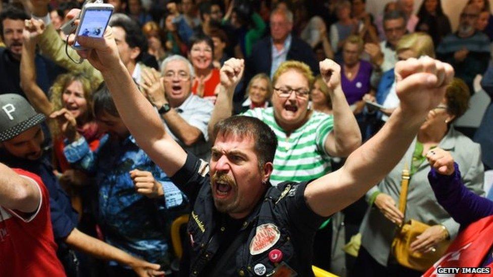 "Barcelona en Comu" (Barcelona in Common) supporters celebrate after their party won the municipal elections on May 24, 2015 in Barcelona, Spain