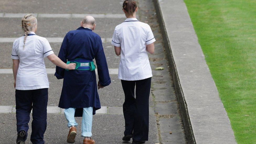 Patient with nurses