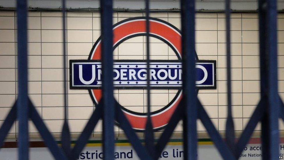 File photo dated 5/8/2015 of a London Underground sign seen through the gates to an entrance at Paddington Underground station